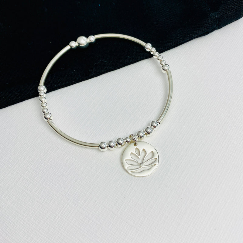 Hand beaded ladies bracelet for yoga fan.Sterling silver bead bracelet with silver lotus flower charm. 