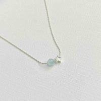 Silver necklace with aquamarine gemstone bead and star bead. Handmade necklace in sterling silver with beads. KookyTwo.