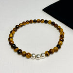 Bracelet for men or women with tiger eye beads. Unisex bracelet with tiger eye beads and silver beads.