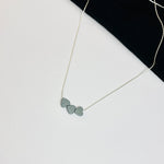 Minimalist sterling silver necklace with three cute hematite heart beads. Kooky Two.