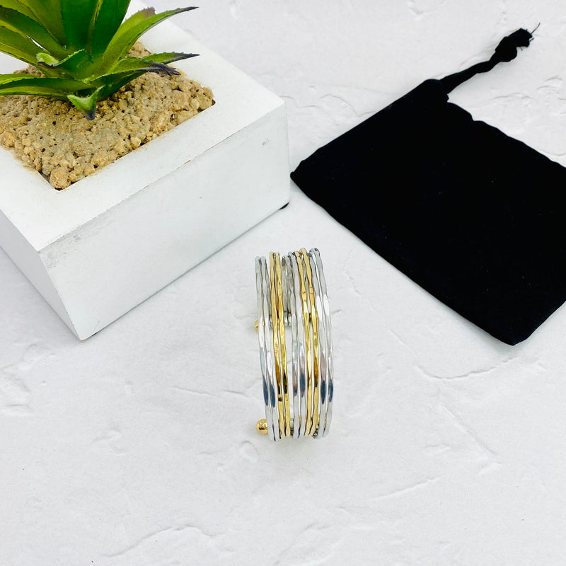 Statement cuff bangle in gold and silver with an adjustable fit. KookyTwo.