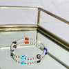 Positivity bracelet with evil eye beads and sterling silver beads. Evil eye trend bracelet.