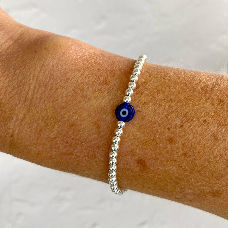 Pretty blue evil eye bracelet with blue evil eye bead and sterling silver beads.