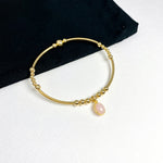 Pink opal jewellery bracelet for her. Handbeaded gemstone bracelet with gold beads and pink opal pendant.