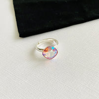 Adjustable sterling silver ring with rose crystal.