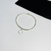Silver organic circle charm bracelet. Hammered circle bracelet with sterling silver beads.