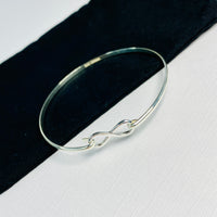 Womens sterling silver infinity charm bangle. Sterling silver infinity bangle.