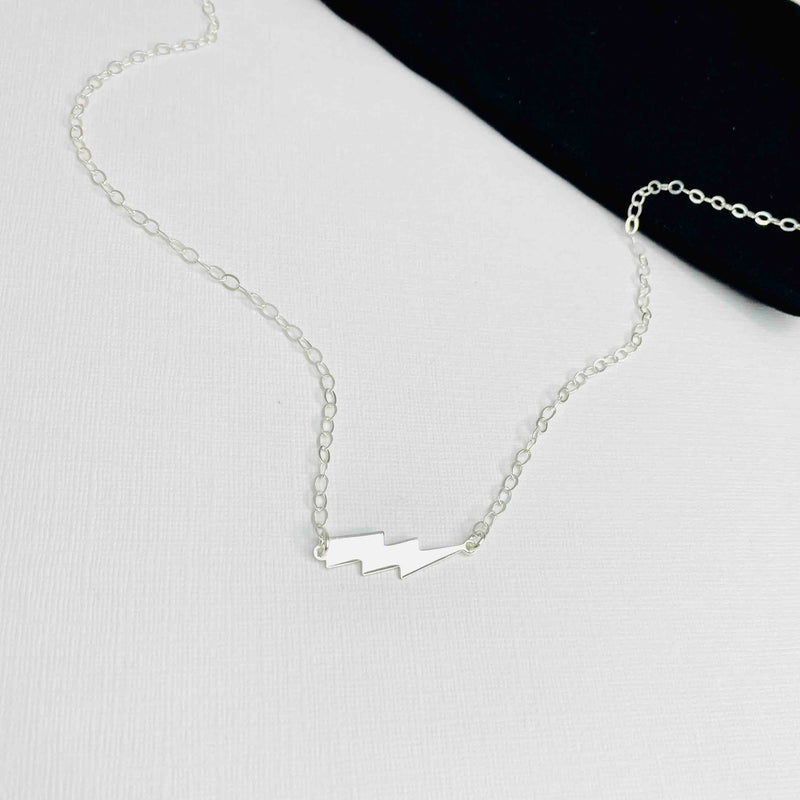 Sterling silver lightning bolt necklace with thunder bolt charm. KookyTwo.