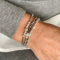 Sterling silver bracelet set with silver beads and sparkly beads. KookyTwo.