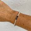 Silver bead bracelet handmade with sterling silver beads and snowflake obsidian gemstones