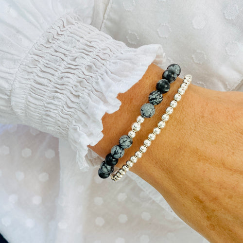 Gemstone bracelet stack with snowflake obsidian beads.