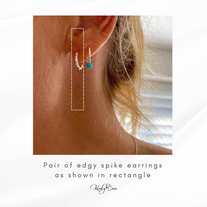 Half hoop earrings with spike design. KookyTwo.