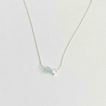 Pretty blue bead necklace with aquamarine gemstone on silver chain. KookyTwo.