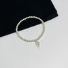 Thoughtful gift idea! A sterling silver bead bracelet with a symbolic angel wing charm. KookyTwo.