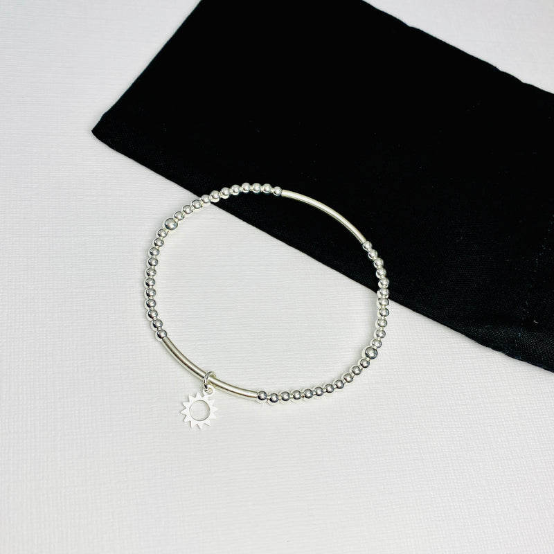 Sterling silver sun charm bracelet for your summer outfits.