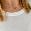 Three lovely rose gold beads on a dainty silver chain. Kooky Two.