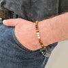 Bracelet for men with tiger eye beads and sterling silver beads.