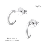 Tiny hoop earrings with stud back style in sterling silver. KookyTwo.
