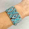 Tiny woven bead bracelet with turquoise blue beads in a geometric pattern. Adjustable summer bead bracelet. KookyTwo