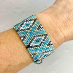 Tiny woven bead bracelet with turquoise blue beads in a geometric pattern. Adjustable summer bead bracelet. KookyTwo