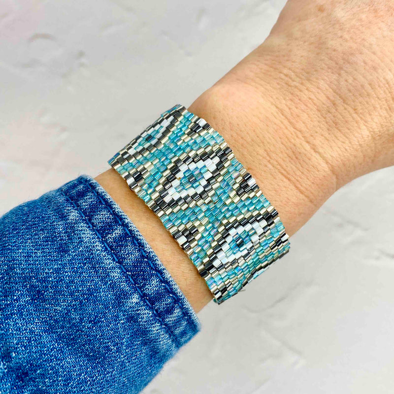 Vibrant blue beaded bracelet with cotton pull cord at back. Adjust to get the perfect fit. KookyTwo.