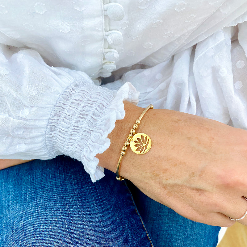 Gold bracelet with lotus flower charm. Bracelet for someone who loves yoga with lotus flower charm. Zen bracelet.
